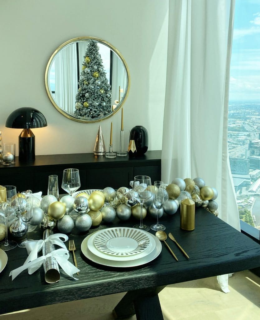 Christmas styling table setting with a gold and silver theme