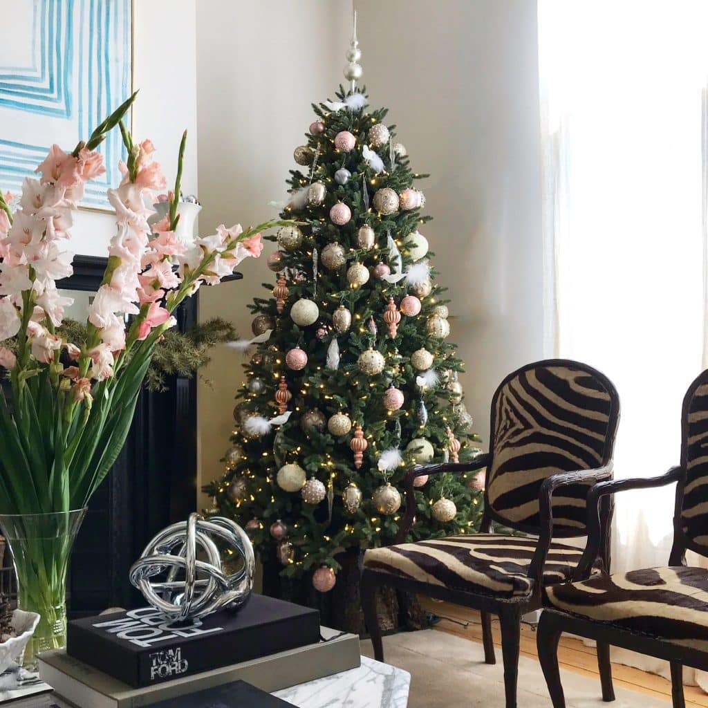 christmas tree and fresh flowers in living room