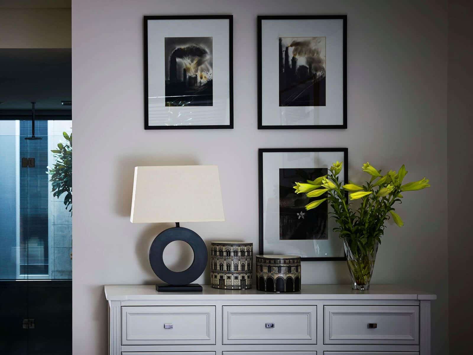 interior of a house with photo frames hanging on the wall. Decor items.
