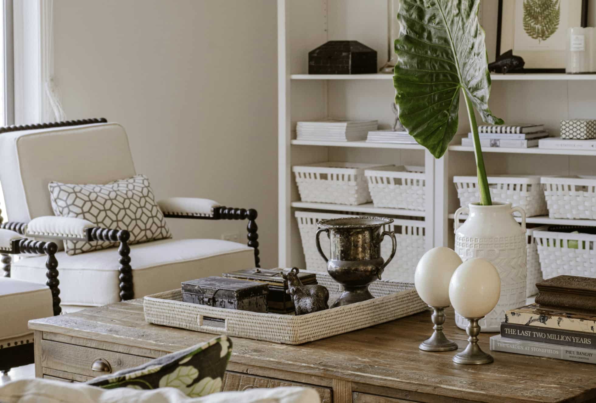 Elegant interior with neutral armchair, wooden coffee table and decorative styling by Gabriel Jacka