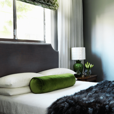 bedroom styling green pillow on bed